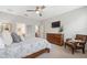 Main bedroom with a bed, dresser, chair, and ensuite bathroom at 17537 Brighton Lake Rd, Land O Lakes, FL 34638