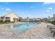 Resort-style pool and lounging area with nearby clubhouse and manicured landscaping at 17537 Brighton Lake Rd, Land O Lakes, FL 34638