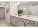 Elegant bathroom featuring double sinks, stylish vanity with modern fixtures, and a bathtub with shower at 18172 Ramble On Way, Land O Lakes, FL 34638