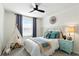 Charming bedroom featuring neutral walls, a cozy bed with decorative pillows, and a playful teepee tent at 18172 Ramble On Way, Land O Lakes, FL 34638