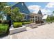 Charming clubhouse with inviting entrance, complemented by manicured landscaping and outdoor seating at 18172 Ramble On Way, Land O Lakes, FL 34638
