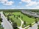 Expansive community park with walking paths, green spaces, and lush landscaping for outdoor enjoyment and recreation at 18172 Ramble On Way, Land O Lakes, FL 34638