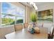 Bright dining area with large windows, stylish decor, and comfortable seating at 18172 Ramble On Way, Land O Lakes, FL 34638