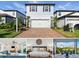 Charming two-story home boasts a paved driveway, two-car garage, and well-maintained landscaping at 18172 Ramble On Way, Land O Lakes, FL 34638