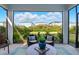 Screened patio with seating offers a relaxing outdoor space with a view of the yard at 18172 Ramble On Way, Land O Lakes, FL 34638