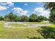 Outdoor playground with natural shade, ideal for to run around and play at 18172 Ramble On Way, Land O Lakes, FL 34638