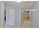 Neutral entryway featuring tile floors and a visible staircase leading to the upper level at 1883 Clearbrooke Dr, Clearwater, FL 33760