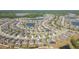 High-angle perspective of a community with curving streets, scenic ponds, and well-maintained properties at 19032 Malinche Loop, Spring Hill, FL 34610