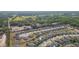 Overhead shot reveals a tidy community with well-kept homes near a picturesque pond and verdant spaces at 19032 Malinche Loop, Spring Hill, FL 34610