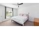 A bright bedroom with a ceiling fan, carpet, and bright window at 19032 Malinche Loop, Spring Hill, FL 34610