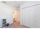 Bedroom showing closet with view to open doorway and hardwood floor, offering ample storage at 19032 Malinche Loop, Spring Hill, FL 34610