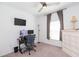 Bedroom with a workstation, ceiling fan, and window at 19032 Malinche Loop, Spring Hill, FL 34610