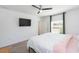 Bedroom with TV, ceiling fan, and a bright window at 19032 Malinche Loop, Spring Hill, FL 34610