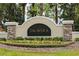 Elegant community sign nestled amid lush landscaping welcomes you to the Talavera neighborhood at 19032 Malinche Loop, Spring Hill, FL 34610