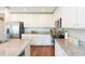 Spacious kitchen featuring white cabinetry, granite countertops, and stainless steel appliances at 19032 Malinche Loop, Spring Hill, FL 34610