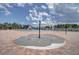 A round splash pad by the community pool with water spraying up from the concrete at 19032 Malinche Loop, Spring Hill, FL 34610