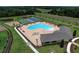 An aerial shot of the community pool area, basketball court, playground, and more at 19032 Malinche Loop, Spring Hill, FL 34610