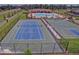 Aerial view of the tennis courts, pool, and pavilion for this community at 19032 Malinche Loop, Spring Hill, FL 34610