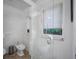 Bathroom with a glass enclosed shower, a bidet, and a window at 1966 Freedom Dr, Clearwater, FL 33755