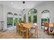 Bright dining room with tiled floors and large windows provides ample natural light at 1966 Freedom Dr, Clearwater, FL 33755