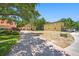Beautiful multi-home compound with a paver driveway, ample parking, and lush landscaping creating a private setting at 1966 Freedom Dr, Clearwater, FL 33755