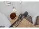 Spacious foyer with chandelier, wooden door, and iron stair railing at 1966 Freedom Dr, Clearwater, FL 33755