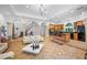 Open floor plan showing the living room, kitchen with bar seating, and grand staircase at 1966 Freedom Dr, Clearwater, FL 33755