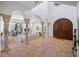 Bright living room with high ceilings, large arched windows, and elegant decor at 1966 Freedom Dr, Clearwater, FL 33755
