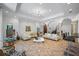 Expansive living room with a large archway, comfortable seating, and a view towards the staircase and kitchen at 1966 Freedom Dr, Clearwater, FL 33755