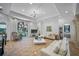 Spacious living area with an arched window, stylish furniture, and modern lighting fixtures at 1966 Freedom Dr, Clearwater, FL 33755