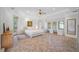 Bright main bedroom with ample windows, sitting area and an ensuite bathroom at 1966 Freedom Dr, Clearwater, FL 33755