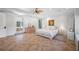 Bright main bedroom with private balcony and ensuite bathroom at 1966 Freedom Dr, Clearwater, FL 33755