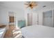 Bright main bedroom with a ceiling fan and access to closet and bathroom at 1966 Freedom Dr, Clearwater, FL 33755