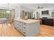 Open kitchen island flows into the living area, creating a seamless, spacious living space at 19808 Sunsplash Ln, Lutz, FL 33558
