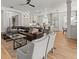 Open floor plan featuring a living room, kitchen with stainless steel appliances, and breakfast nook with lots of light at 19808 Sunsplash Ln, Lutz, FL 33558