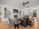 Living room with a fireplace, built-in shelving, and tile flooring at 19808 Sunsplash Ln, Lutz, FL 33558