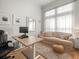 Bright office area with a sofa, desk, and plush rug, illuminated by natural light at 19808 Sunsplash Ln, Lutz, FL 33558