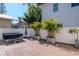 Landscaped backyard features a paver patio, white fencing, and a hot tub at 212 W Floribraska Ave, Tampa, FL 33603