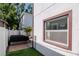 Backyard featuring a hot tub and artificial grass at 212 W Floribraska Ave, Tampa, FL 33603