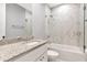Clean bathroom featuring a glass shower, white cabinets, and granite countertops at 212 W Floribraska Ave, Tampa, FL 33603