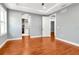 Large bedroom featuring hardwood floors, and two doorways to other rooms at 212 W Floribraska Ave, Tampa, FL 33603