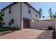 Exterior showcasing a two-car garage, paver driveway, and manicured landscaping at 212 W Floribraska Ave, Tampa, FL 33603