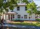 Charming two-story home with manicured lawn and mature trees at 212 W Floribraska Ave, Tampa, FL 33603