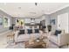 Bright and airy living room with modern decor flowing seamlessly into a well-equipped kitchen at 212 W Floribraska Ave, Tampa, FL 33603