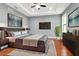 Serene main bedroom featuring a plush bed, a TV, and stylish decor elements at 212 W Floribraska Ave, Tampa, FL 33603