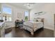 Bright bedroom with hardwood floors, ample natural light, and neutral tones, ideal for relaxation and comfort at 2604 S Bryant Cir, Tampa, FL 33629