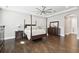Spacious bedroom with hardwood floors, tray ceilings and classic-style furniture at 2604 S Bryant Cir, Tampa, FL 33629