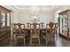 Refined dining room with hardwood floors, elegant chandelier, and custom display cabinets for formal entertaining at 2604 S Bryant Cir, Tampa, FL 33629