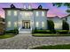 Stately two-story home features a brick driveway, manicured landscaping, and a welcoming front entrance at 2604 S Bryant Cir, Tampa, FL 33629