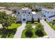 Stately home featuring a large front lawn, manicured shrubbery and a circular driveway at 2604 S Bryant Cir, Tampa, FL 33629